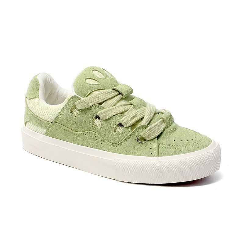 Light green sneaker with white sole on a white background