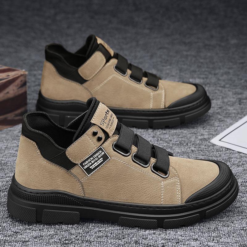 Beige and black casual shoes on a textured surface