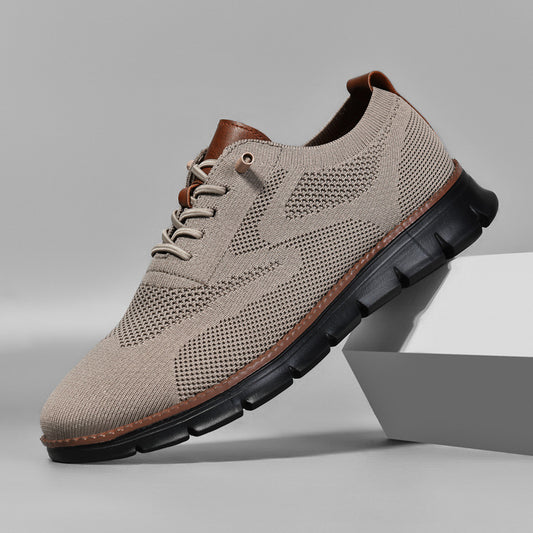 Beige sneaker with brown accents on a gray background