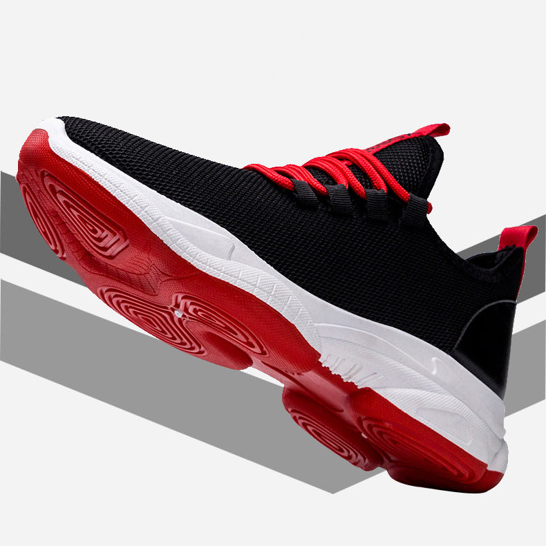Black and red athletic shoe on a gray background