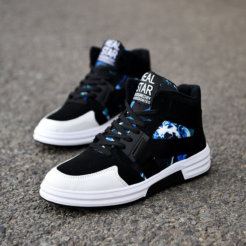 Black and white sneakers with blue accents on a gray pavement background