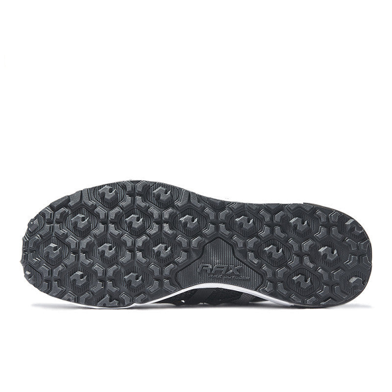 Black athletic shoe sole with brand logo on a white background