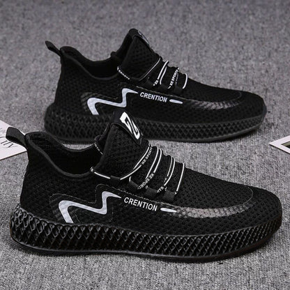 Black athletic shoes with white branding on a gray surface