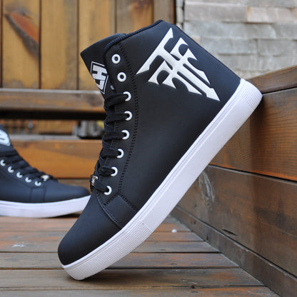 Black high-top sneakers with white soles on a wooden surface