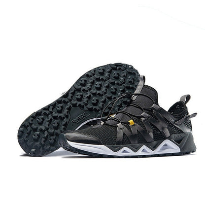 Black hiking shoes with white sole on a white background