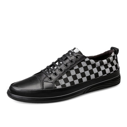 Black leather loafer shoe on a white background