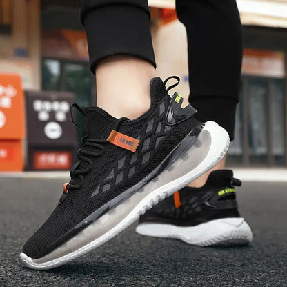 Black running shoes with white soles worn by a person on a blurred street background
