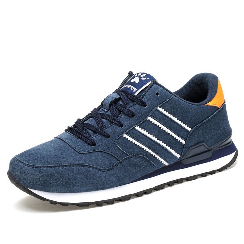 Blue Adidas sneaker with white stripes on a white background