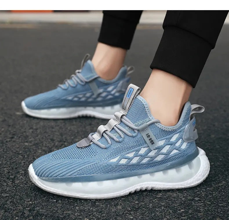 Blue athletic shoes worn on a black surface