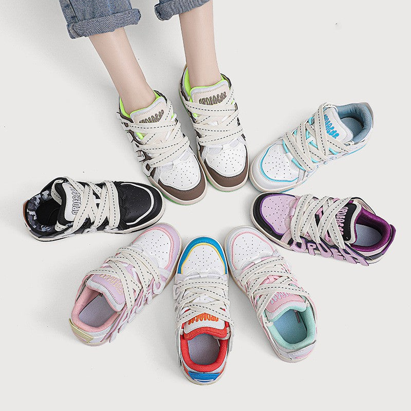 Colorful children's sneakers on a white background