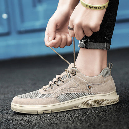 Person tying the laces of a beige sneaker on a blurred background