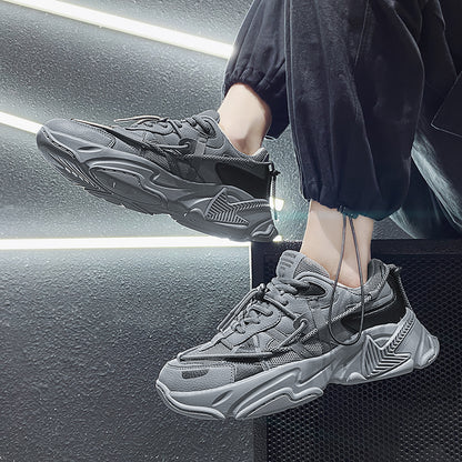 Person wearing gray sneakers with a modern interior background