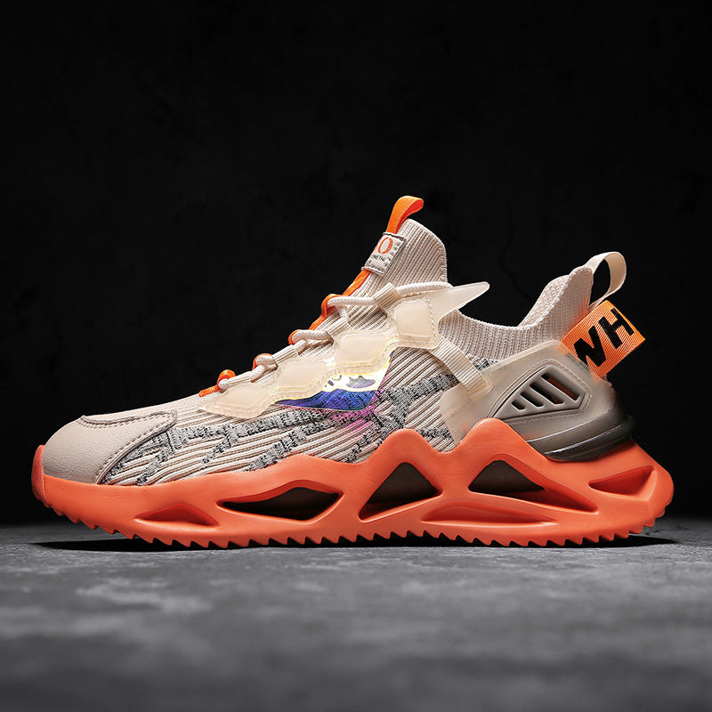 Sneaker with orange sole and beige upper on a dark background