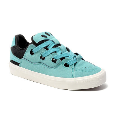 Turquoise sneaker with black accents on a white background