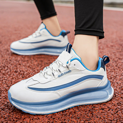 White and blue athletic shoes on a red textured surface