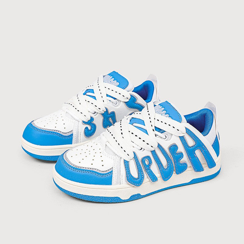 White and blue sneakers with 'URBAN' branding on a light gray background