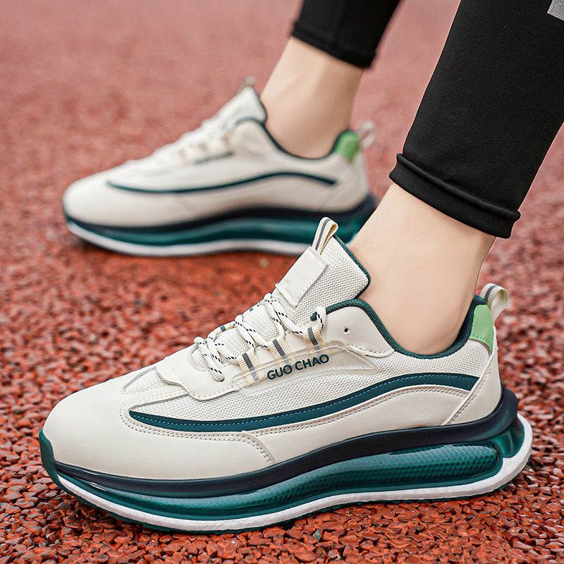 White and green sneakers with brand name on a textured surface