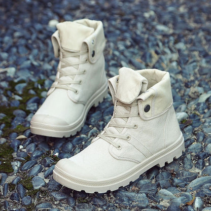 White high-top boots on a textured blue and gray surface