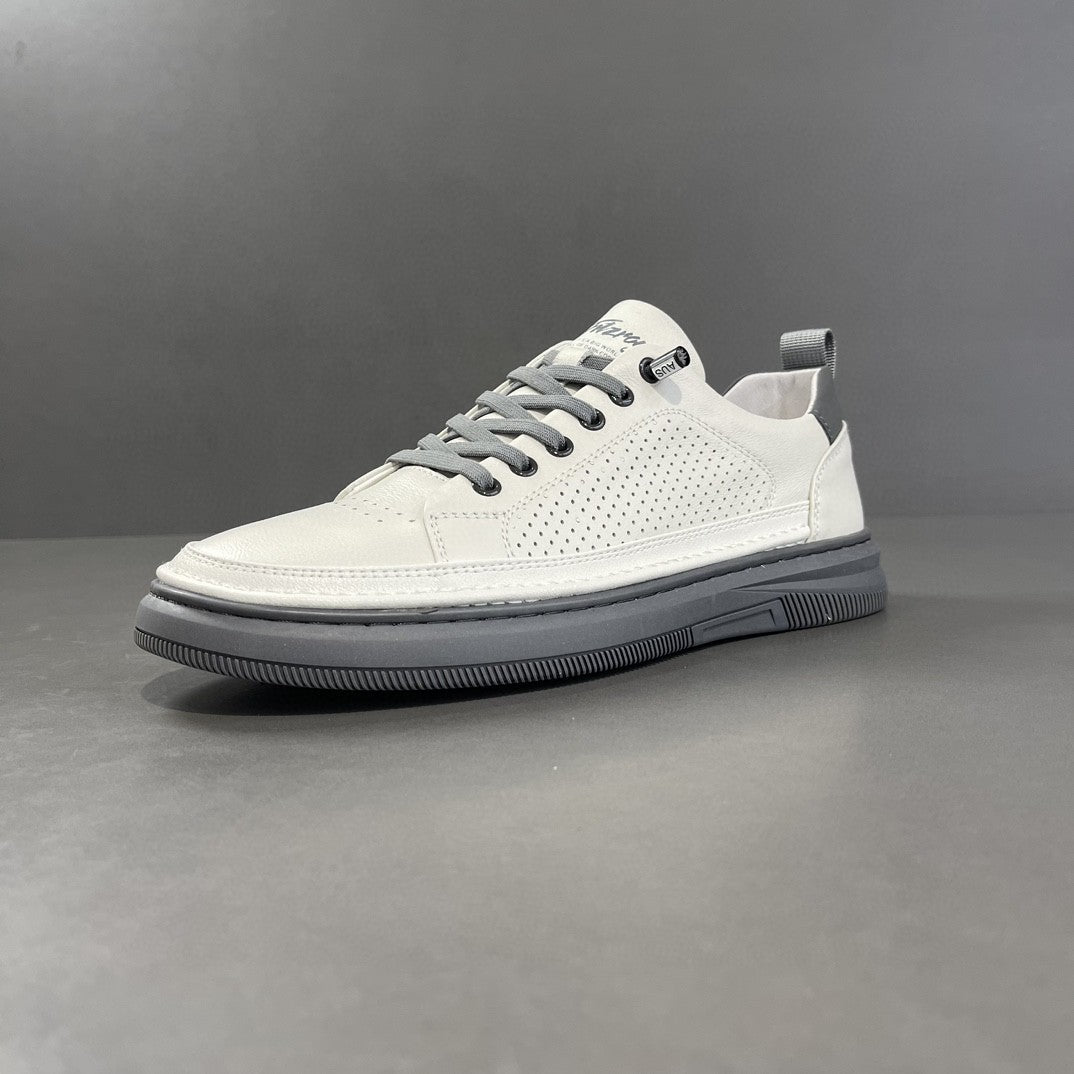 White sneaker with gray laces on a gray background