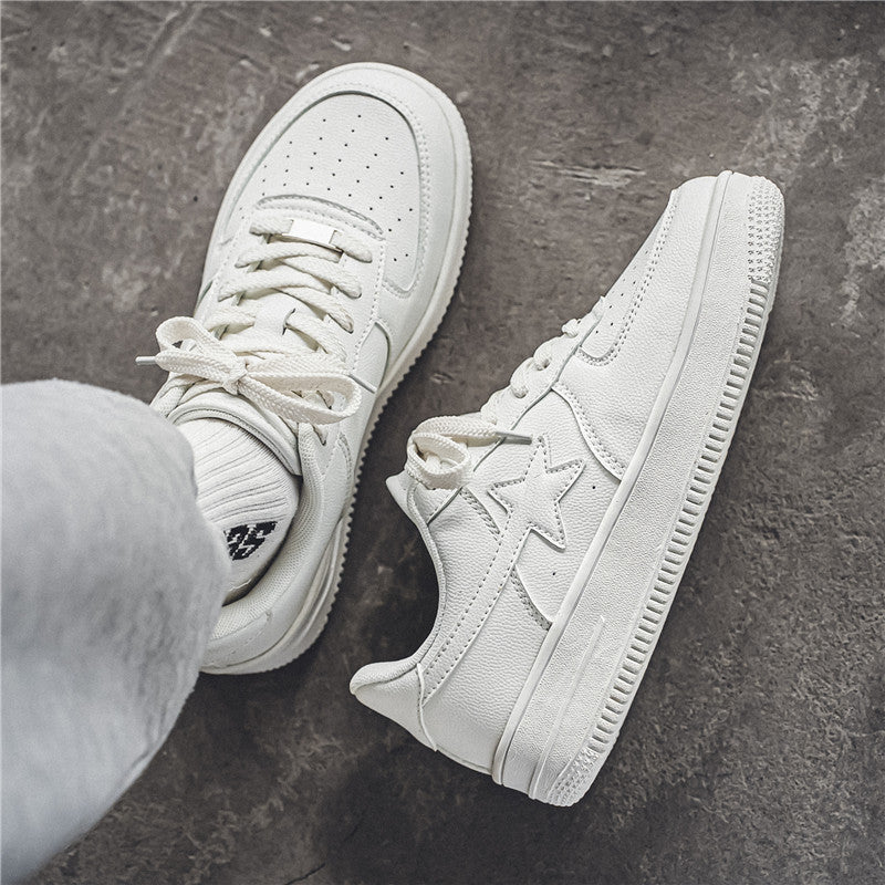 White sneakers on a dark textured surface