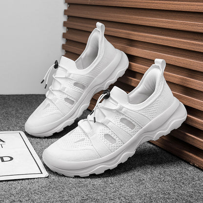 White sneakers on a gray surface with a wooden panel background