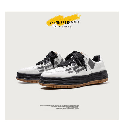 White sneakers with black accents on a light gray background, featuring 'V-SNEAKER/2021-V NEWS' text.
