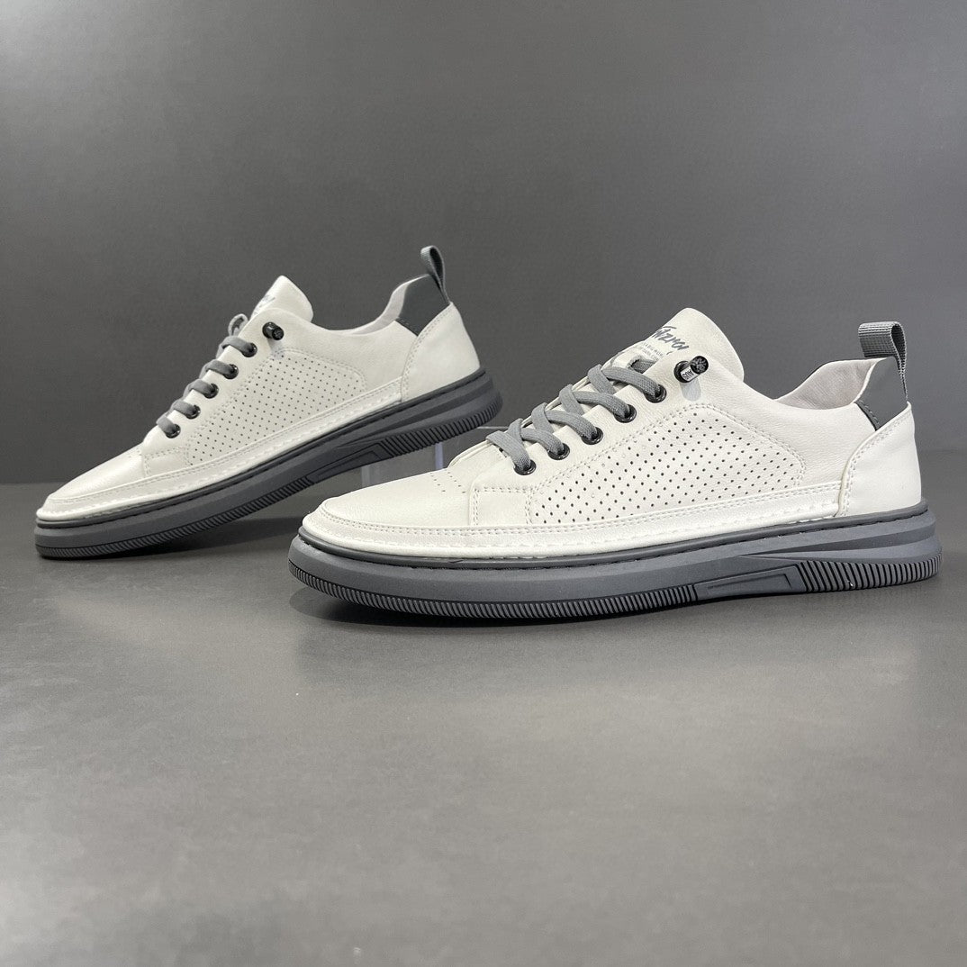 White sneakers with gray soles on a dark gray background