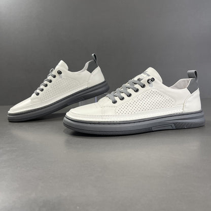 White sneakers with gray soles on a dark gray background