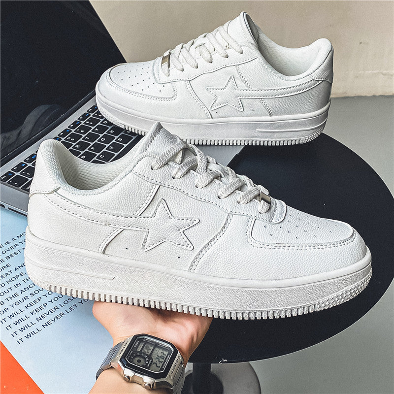White sneakers with star design on a laptop