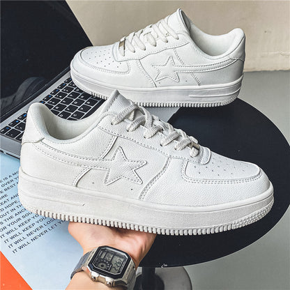 White sneakers with star design on a laptop